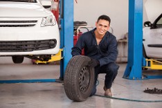 Mechanic with Tire Mechanic with Tire